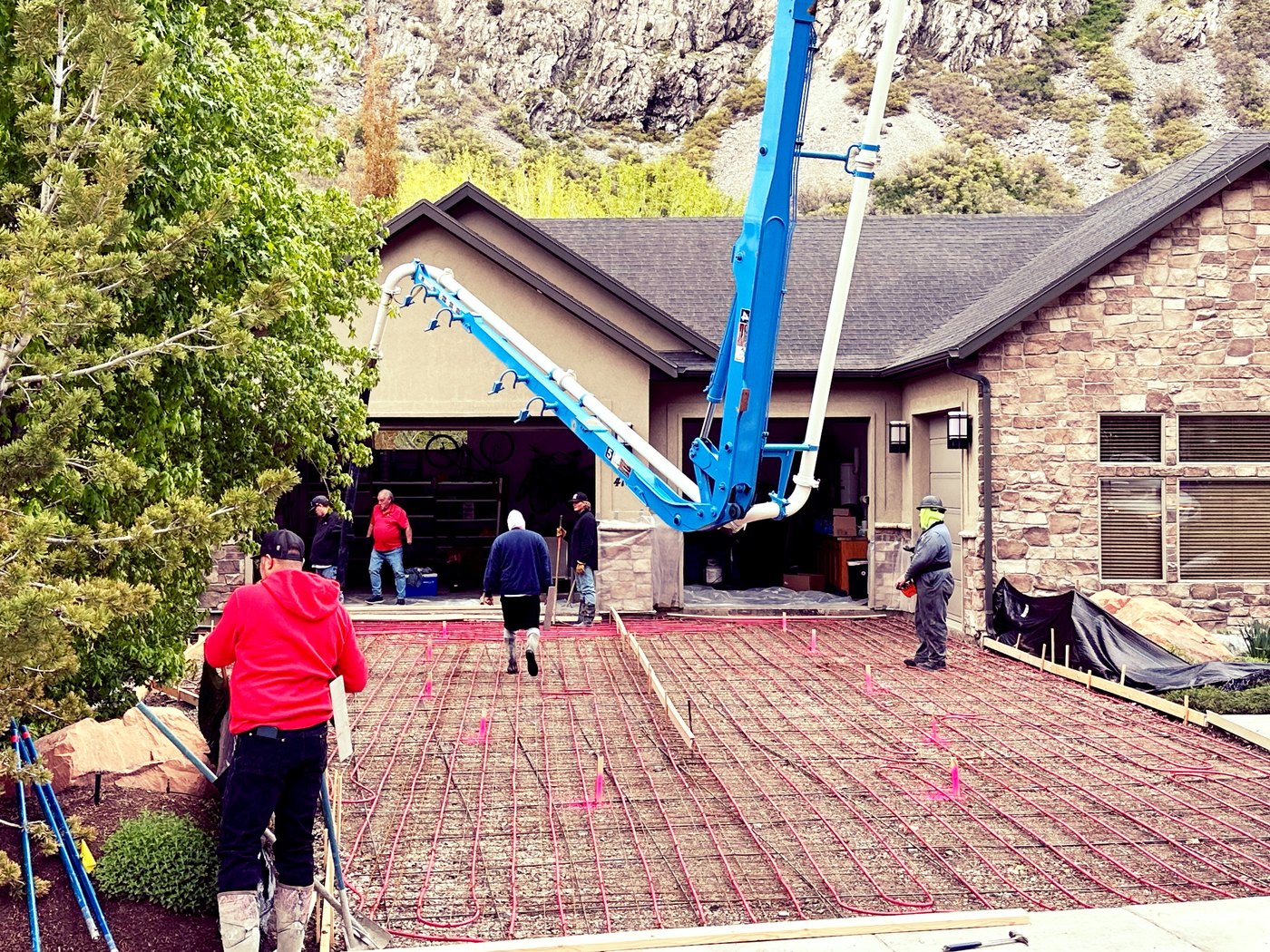 Concrete pump boom extended over a pour area